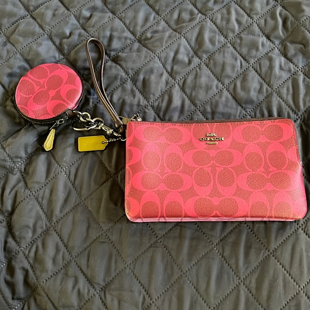 Double wristlet with matching coin pouch. Pink and purple